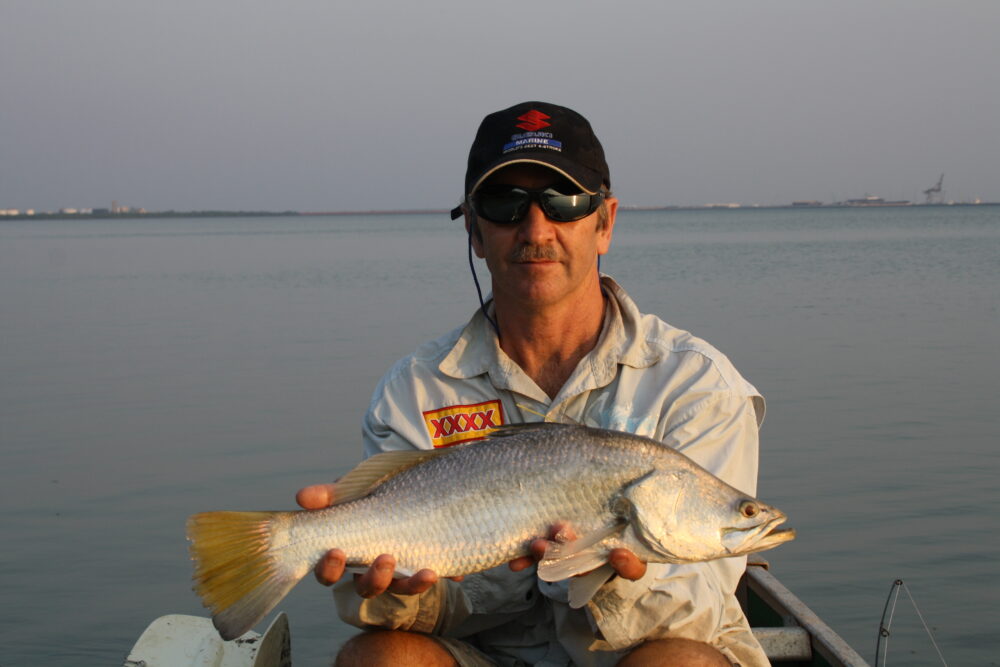 Wayne with a typical sized harbour barra.