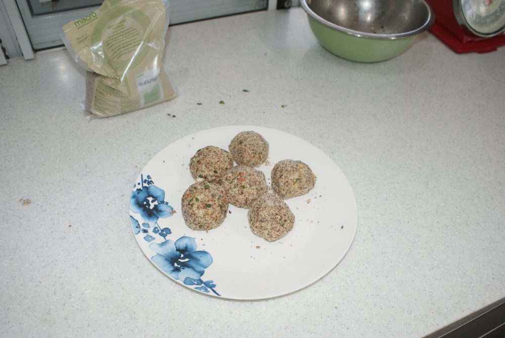 Form into balls and roll in almond meal.